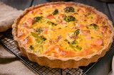 Traditional broccoli pie with salmon and cheese. Food from healthy and healthy foods. Lunch.
