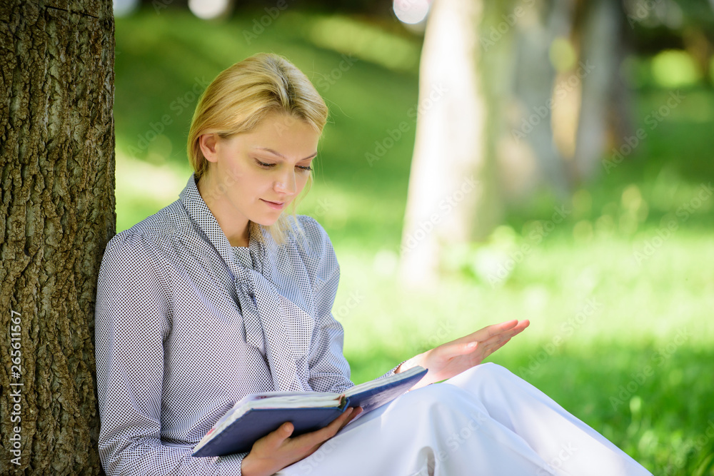 Girl concentrated sit park lean tree trunk read book. Reading inspiring books. Bestseller top list. Books every girl should read. Relax leisure an hobby concept. Best self help books for women Girl concentrated sit park lean tree trunk read book. Reading inspiring books. Bestseller top list. Books every girl should read. Relax leisure an hobby concept. Best self help books for women