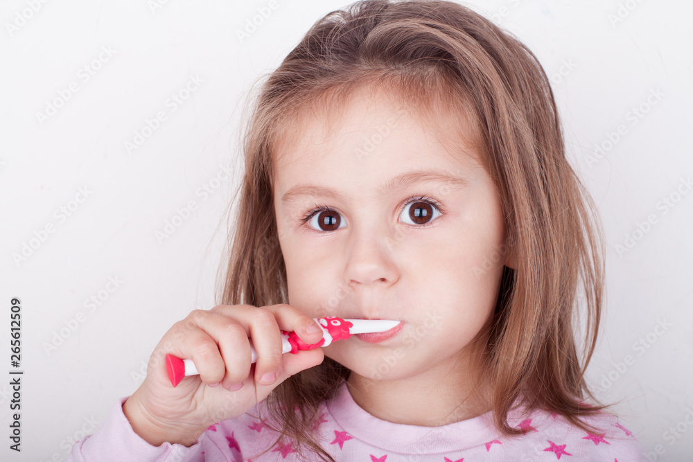Cute little girl brushing her teeth Cute little girl brushing her teeth