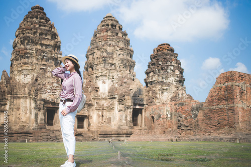 Beautiful Asian women, beautiful Thai people, casual wear, and wearing a hat standing in front of Phra Prang Sam Yot, Lop Buri Province, is an important historical and archaeological site. © MPIX.TURE
