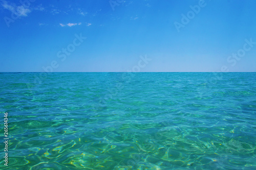 Transparent clean sunny ocean sea water waves for background and texture.