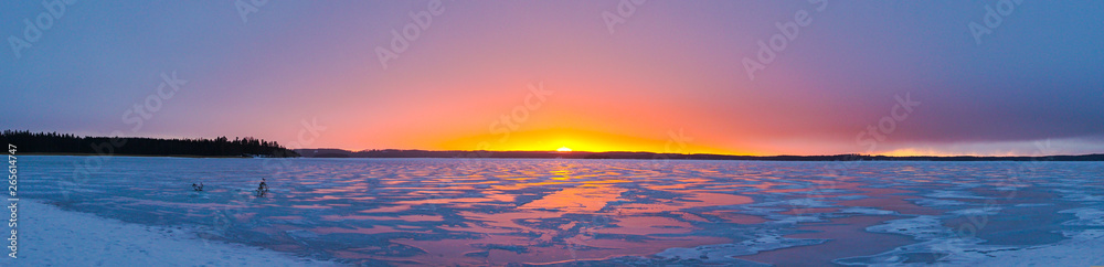 sunset over lake at winter