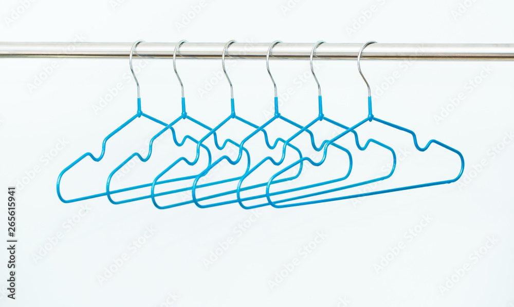 Empty hangers on a white background. The concept of nothing to wear, no clothes. It's time for shopping. Multicolored bright hangers fashionable colors. Fashion style and discounts.