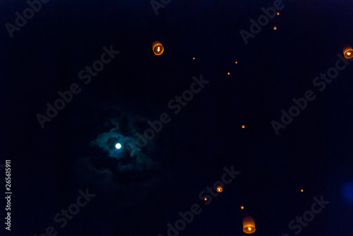 Lanterns at the night sky with full moon