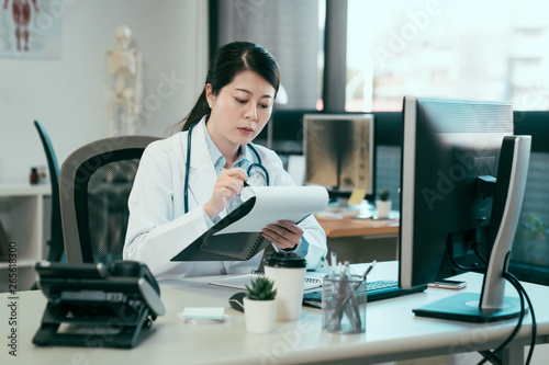 nurse working on paperwork in hospital