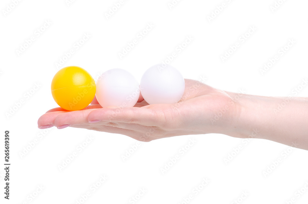 Balls for playing table tennis in hand on a white background isolation Balls for playing table tennis in hand on a white background isolation