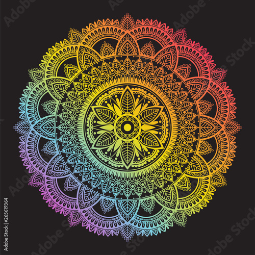Colorful rainbow ethnic mandala on black background. Circular decorative pattern.