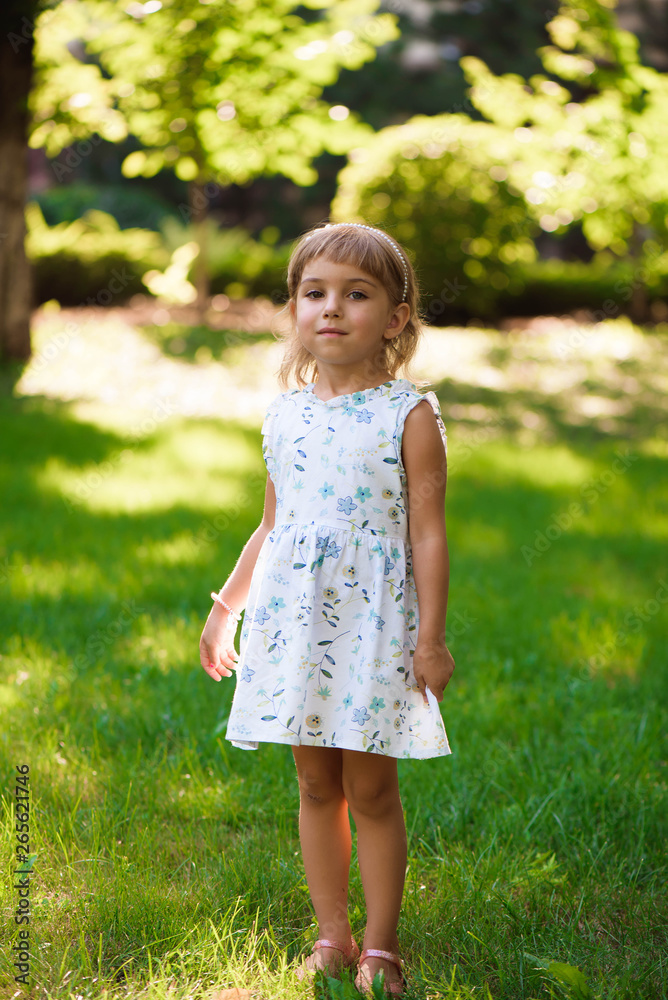 Llittle girl child outdoor in summer day. Llittle girl child outdoor in summer day.