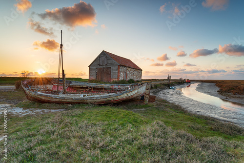 Sunset over the old harbour at Thornham