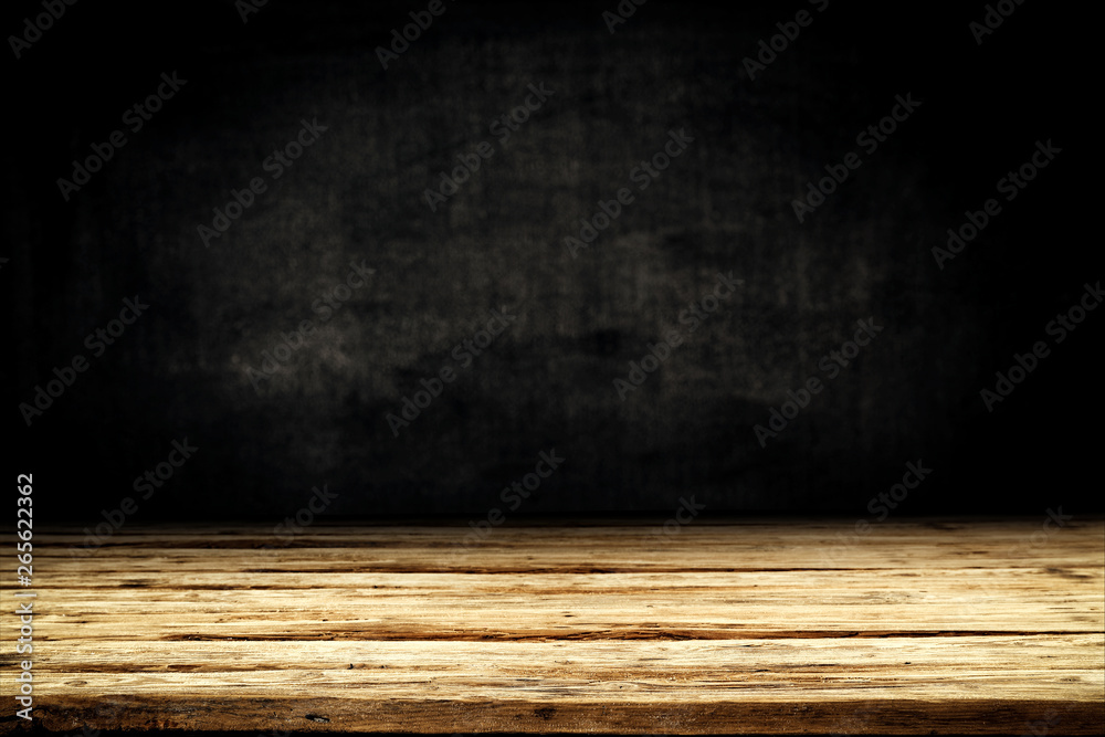 Dark desk background of free space for your decoration and black wall space Dark desk background of free space for your decoration and black wall space