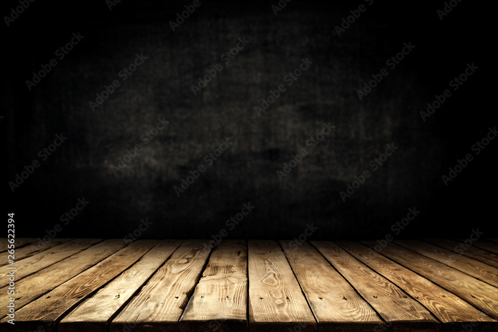 Dark desk background of free space for your decoration and black wall space Dark desk background of free space for your decoration and black wall space