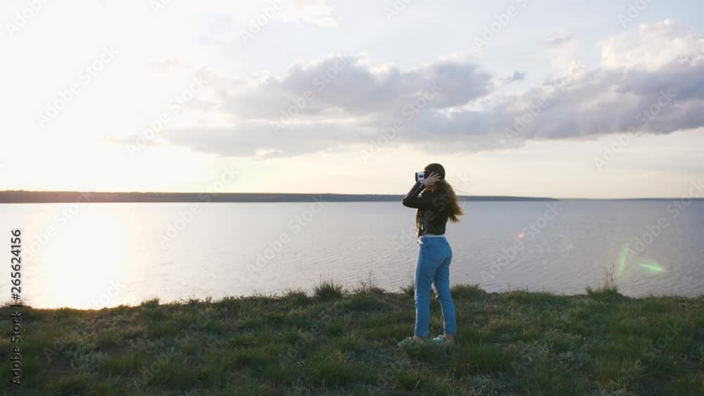 Portrait of young woman in vr glasses outdoors with beatiful sea sunset background, slow motion Portrait of young woman in vr glasses outdoors with beatiful sea sunset background, slow motion