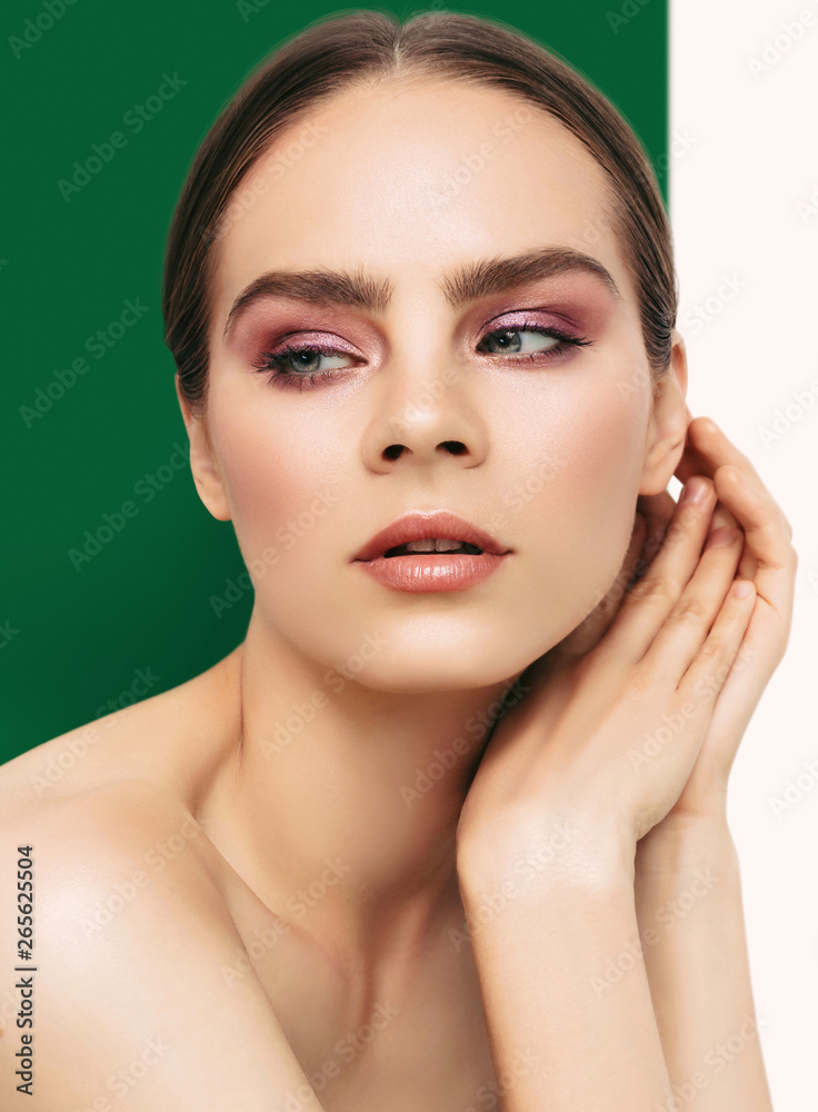 Beauty Fashion model portrait with perfect skin and pink glossy eye shadow make up Beauty Fashion model portrait with perfect skin and pink glossy eye shadow make up