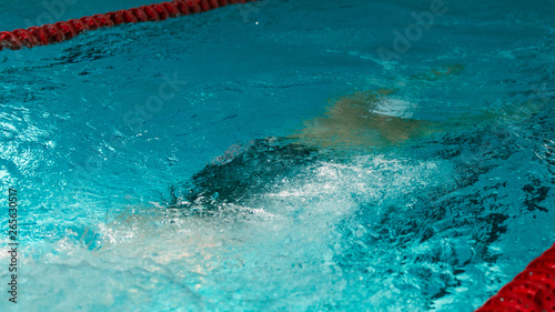 Swimming underwater at sporting events in the pool
