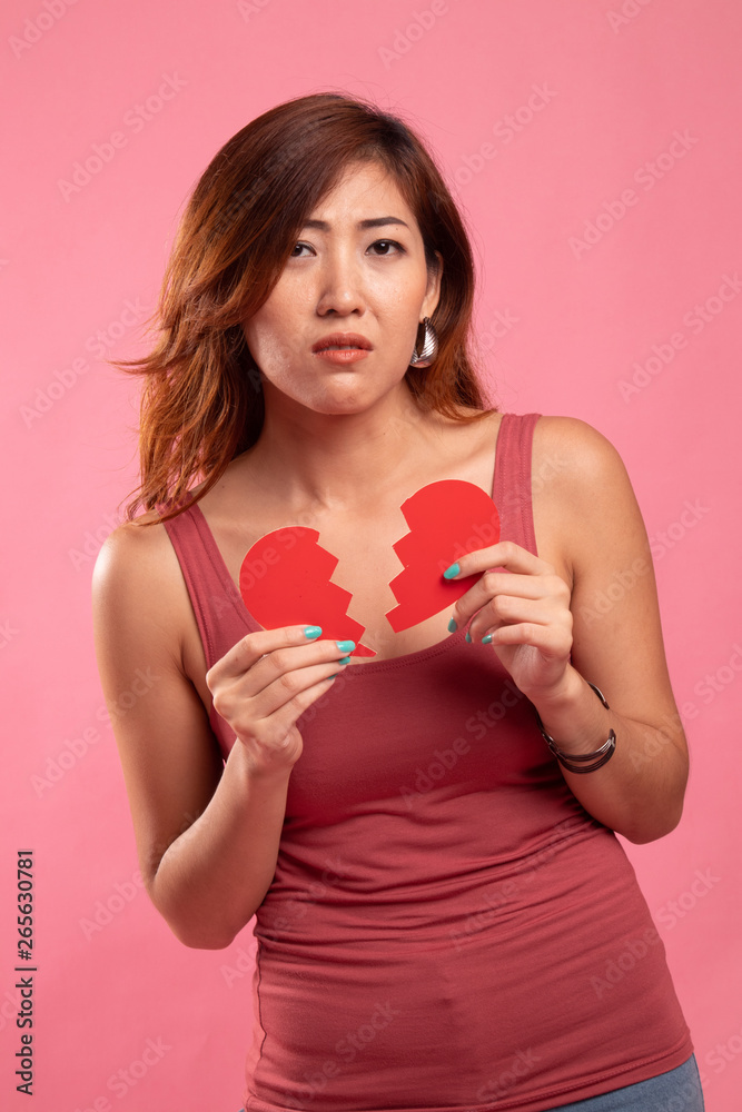 Beautiful young Asian woman with broken heart. Beautiful young Asian woman with broken heart.