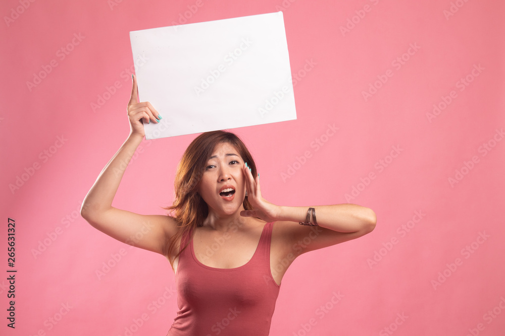 Young Asian woman surprise with white blank sign. Young Asian woman surprise with white blank sign.