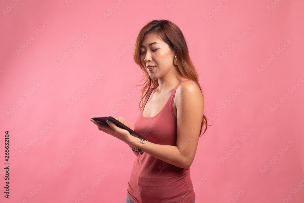 Full body of young Asian woman with a computer tablet.