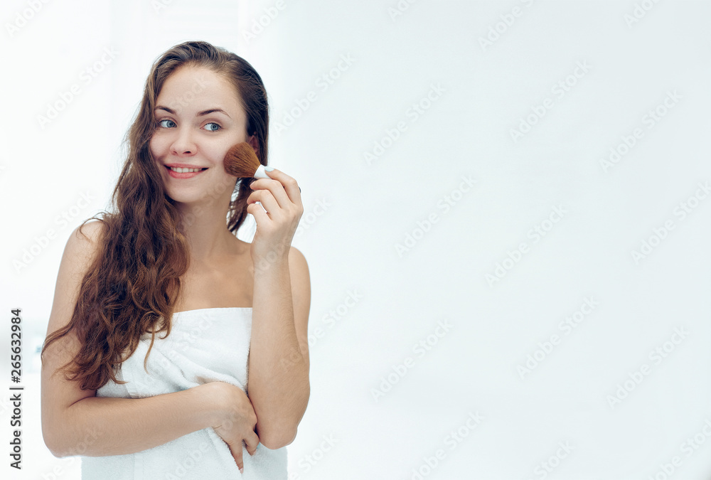 Beautiful girl with cosmetic powder brush for make up. Makeup. Make-up applying for perfect skin. Beautiful girl with cosmetic powder brush for make up. Makeup. Make-up applying for perfect skin.