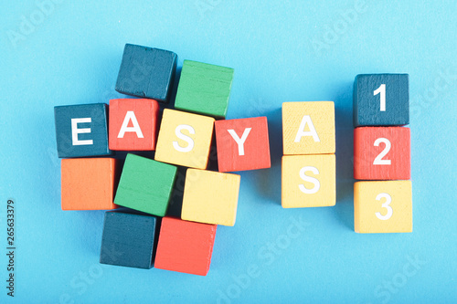 Tablou pe pânză Offering solutions or alternatives concept, EASY AS 123 word on wooden cube over