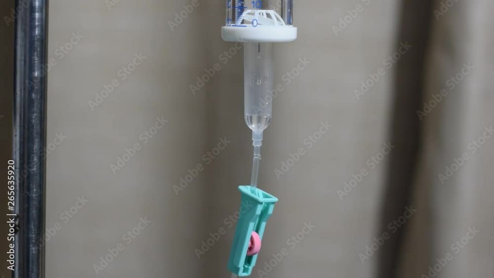 Intravenous therapy iv infusion set and bottle on a pole. Liquid saline