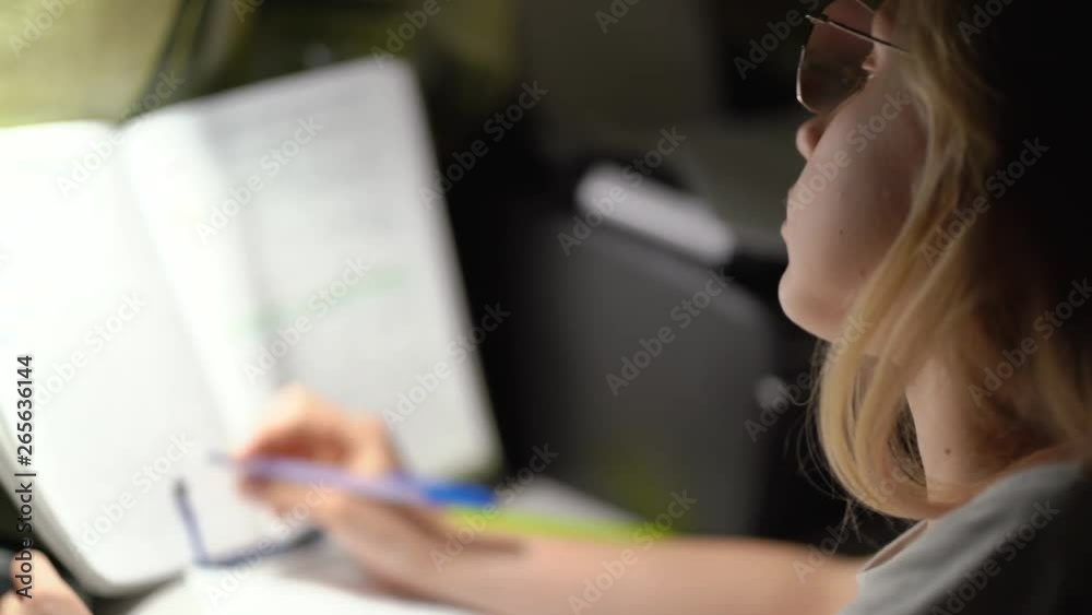 Girl doing homework in mathematics. School life concept. Shooting with hands. 4K Video Girl doing homework in mathematics. School life concept. Shooting with hands. 4K Video