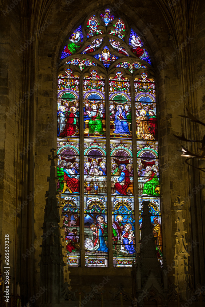  Stained glass window at the Collegiale church of Saint Emilion, France