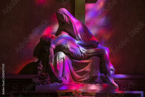 Pieta in Hues of Purple and red - symbolic reference to the color of the wine in the Collegiale church of St Emilion, France