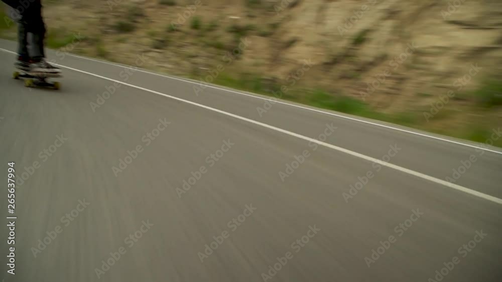 downhill longboard in the mountains in the fog in the morning
