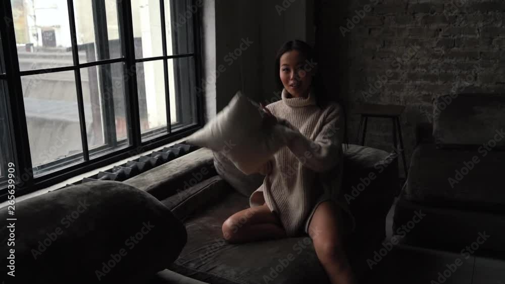 Young Asian woman pointing at you and looking at camera. Body language, winking girl smiling playfully pointing finger to you. Young Asian woman pointing at you and looking at camera. Body language, winking girl smiling playfully pointing finger to you.