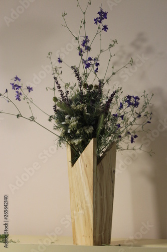 Fototapeta Naklejka Na Ścianę i Meble -  Blue field flowers in a wooden vase