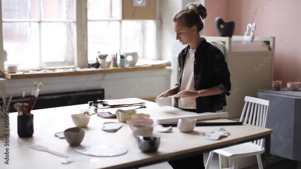 custom made wallpaper toronto digitalwoman is packing a ceramic plate while standing in the workshop