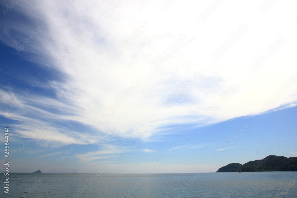 Blue sky with clouds over the sea for background, wallpapers, seascape and clear sky  background.