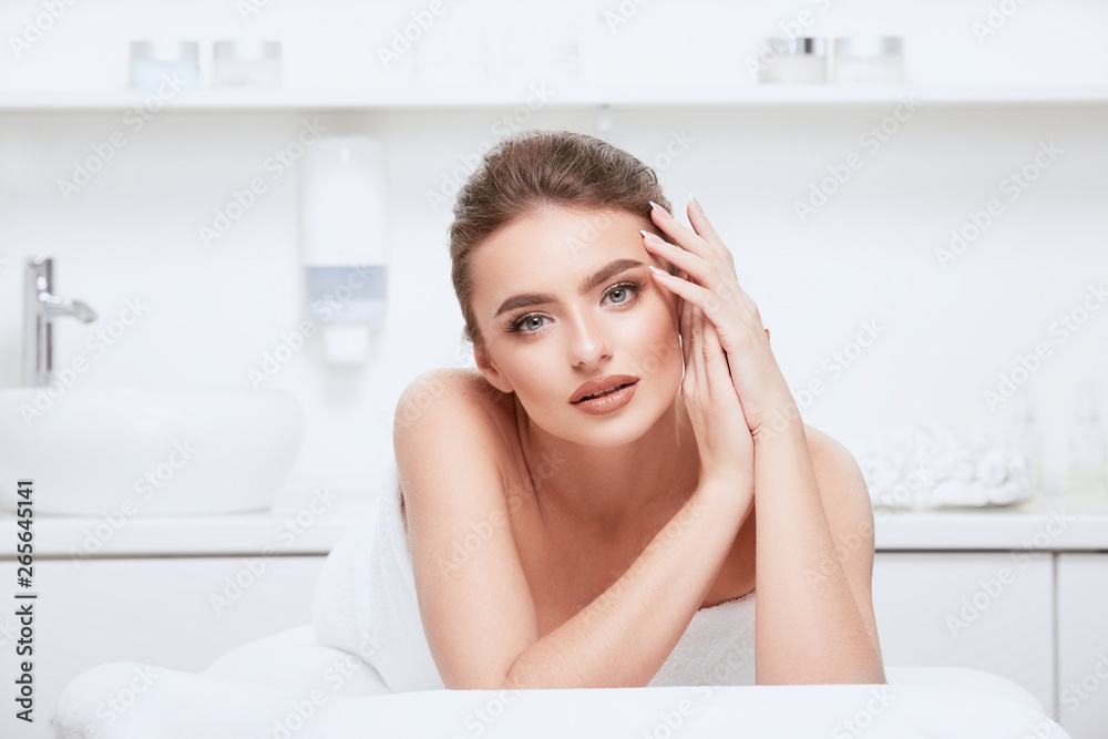 Beautiful girl with nude make up at spa cabinet Beautiful girl with nude make up at spa cabinet