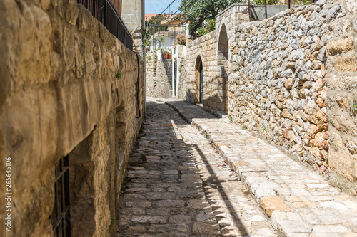 Fototapeta Naklejka Na Ścianę i Meble -  This is a capture of the old roads in Der El Kamar a village Located in Lebanon and you can see in the picture the old walk made of stones with an historic architecture for walls and houses 