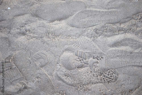 Footprints on the sandy. Top view sand background and texture on the beach.