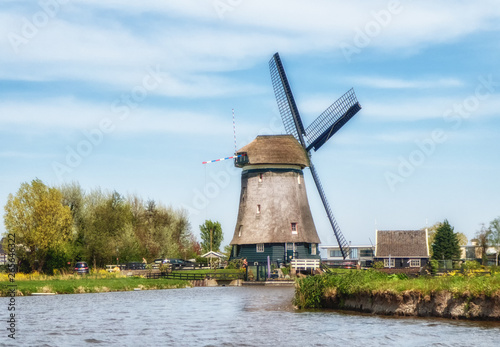 Dutch Windmill as seen from a canal photo