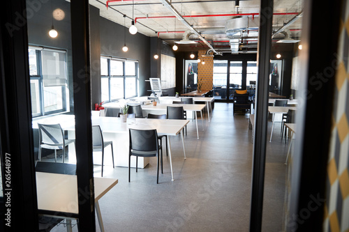 Fotografie Dining area in the office of a creative business, seen from doorway in daylight,