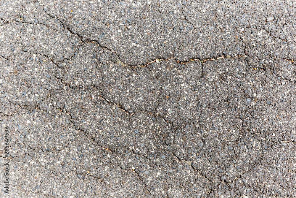 Cracked asphalt road on hot summers day. Cracked asphalt road on hot summers day.
