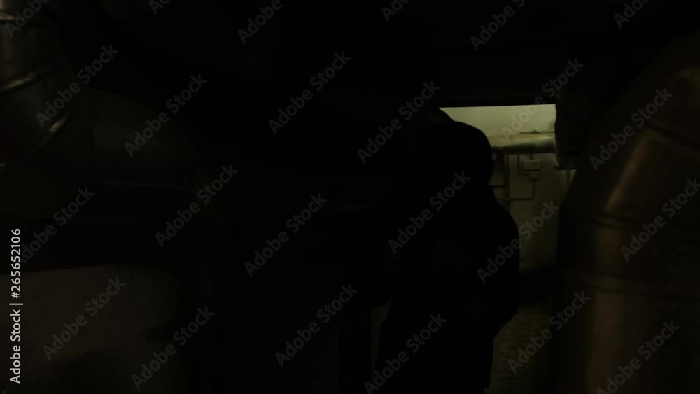 Special agent in camouflage goes through the building with a weapon. Fully Equipped Soldiers Wearing Camouflage Uniform Attacking Enemy, Rifles Ready to Shoot. Special agent in camouflage goes through the building with a weapon. Fully Equipped Soldiers Wearing Camouflage Uniform Attacking Enemy, Rifles Ready to Shoot.