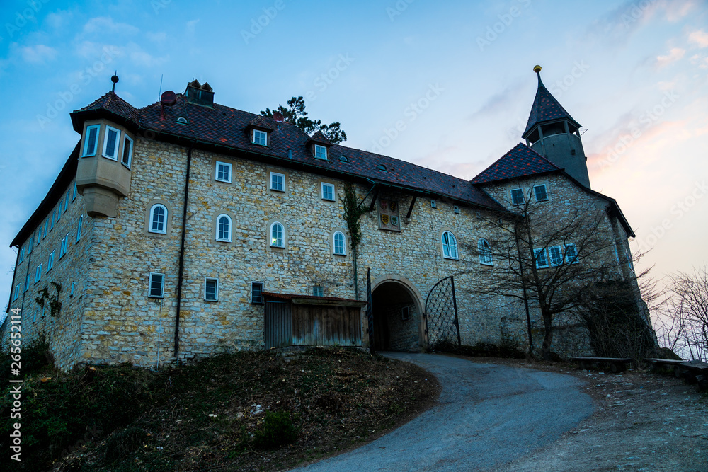 Germany, Ancient walls of popular castle teck in swabian alb nature landscape in magic twilight