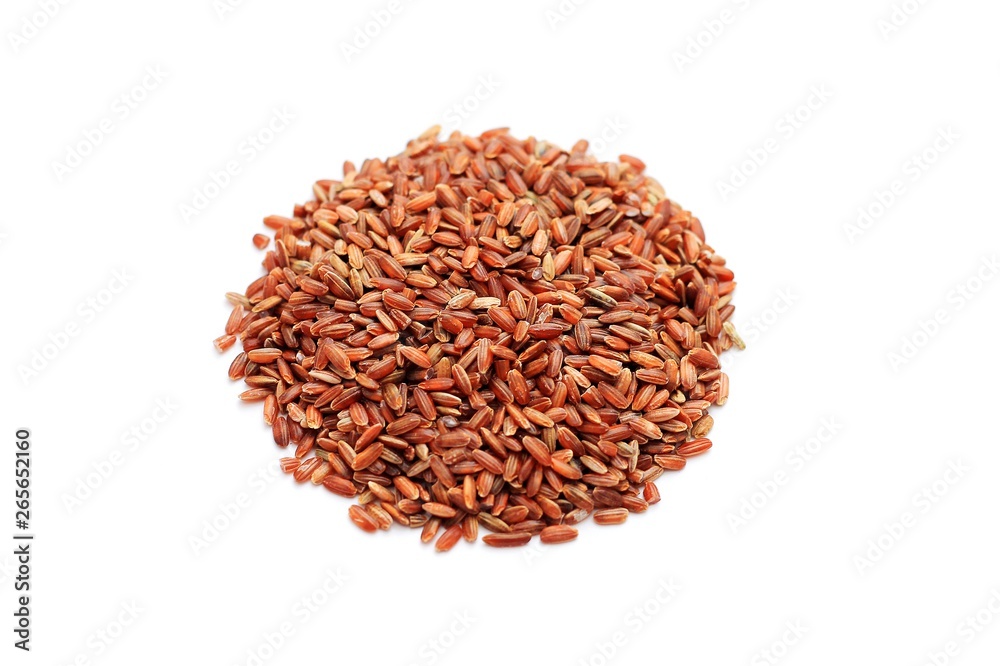 brown rice scattered on a white background brown rice scattered on a white background