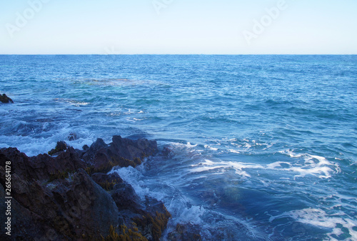 View of the blue azure sea lagoon gulf of the ocean. Summer heat nature on the southern island of the mountain rocks stones.