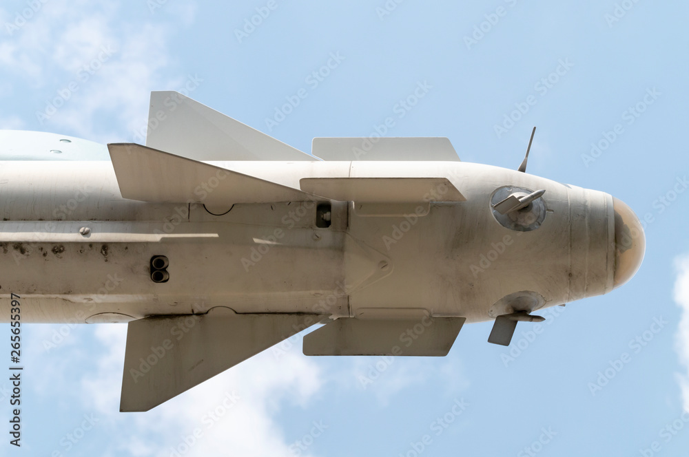 combat missile close-up against the sky, the missile is located horizontally to the right combat missile close-up against the sky, the missile is located horizontally to the right