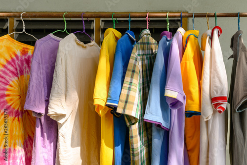 Colorful male shirt hanging on clothes line in sunny