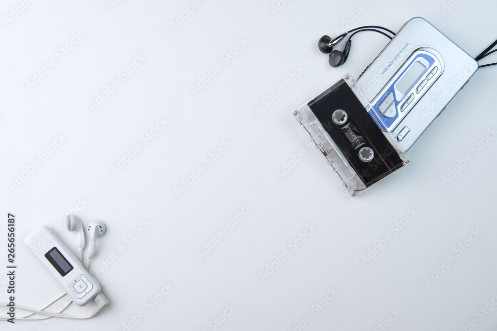 Concept old vs new inventions. Audio cassette player and modern mp3