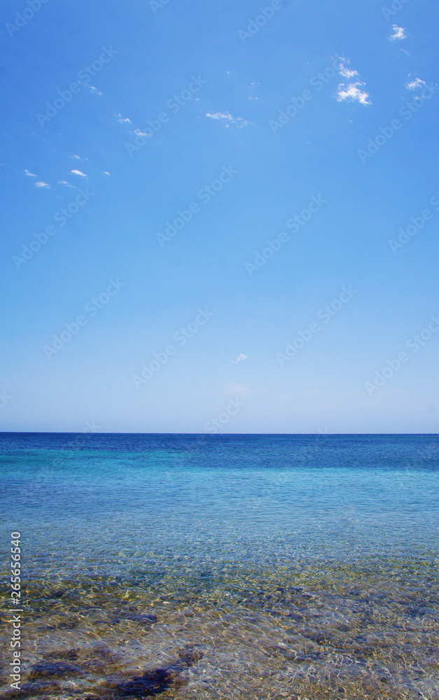 Blue sea landscape with sky on the horizon. Calm ocean waves summer tropics lagoon.