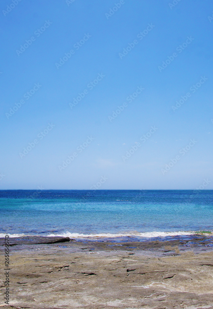Blue sea landscape with sky on the horizon. Calm ocean waves summer tropics lagoon.