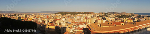 Fototapeta Naklejka Na Ścianę i Meble -  Panorama cityscape view from above on the old medieval European Italian city with red roofs in the summer in the sun.