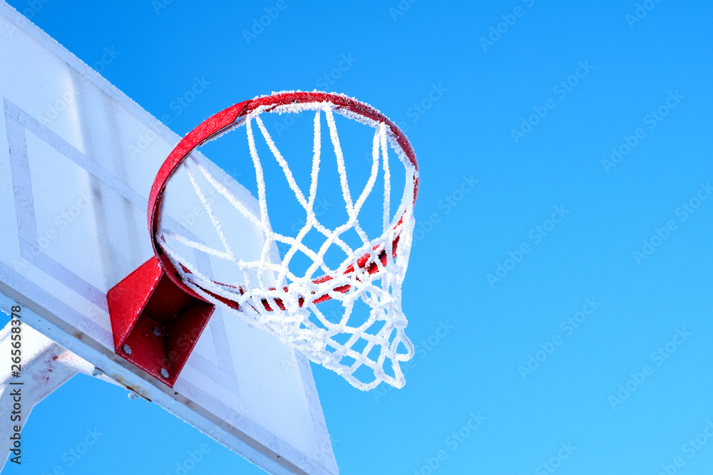winter basketball in Russia blue sky and frozen ring
