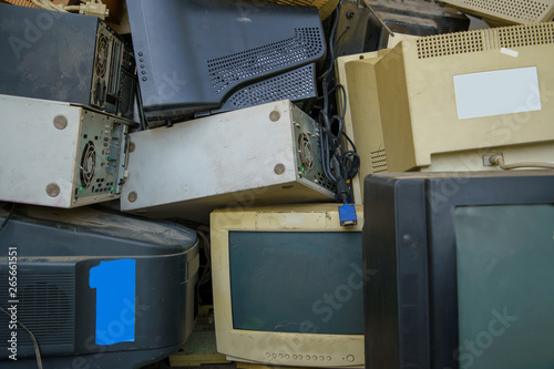 electronic waste stack together Monitor, Printer, desktop computer, fax for waiting to be recycled. Produced from plastic, copper, glass can be reused. photo